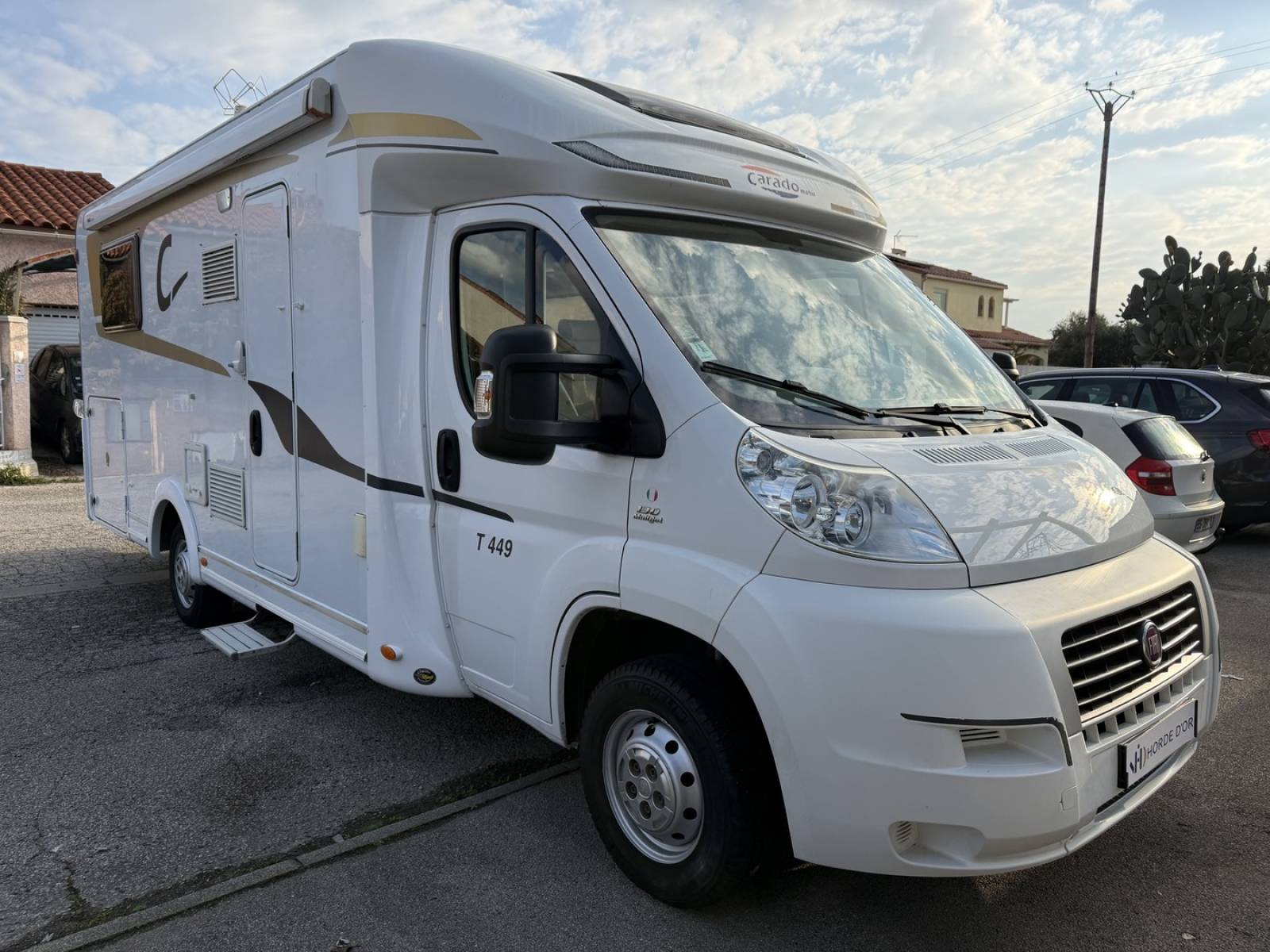 Profilé CARADO T 449 - FIAT DUCATO 2.3L 130CH - Lit central et lit pavillon 2 personnes - Soute garage - Equipement complet